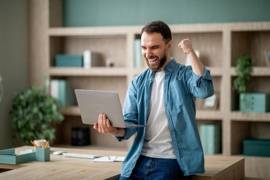 Young Happy Businessman Celebrating Success