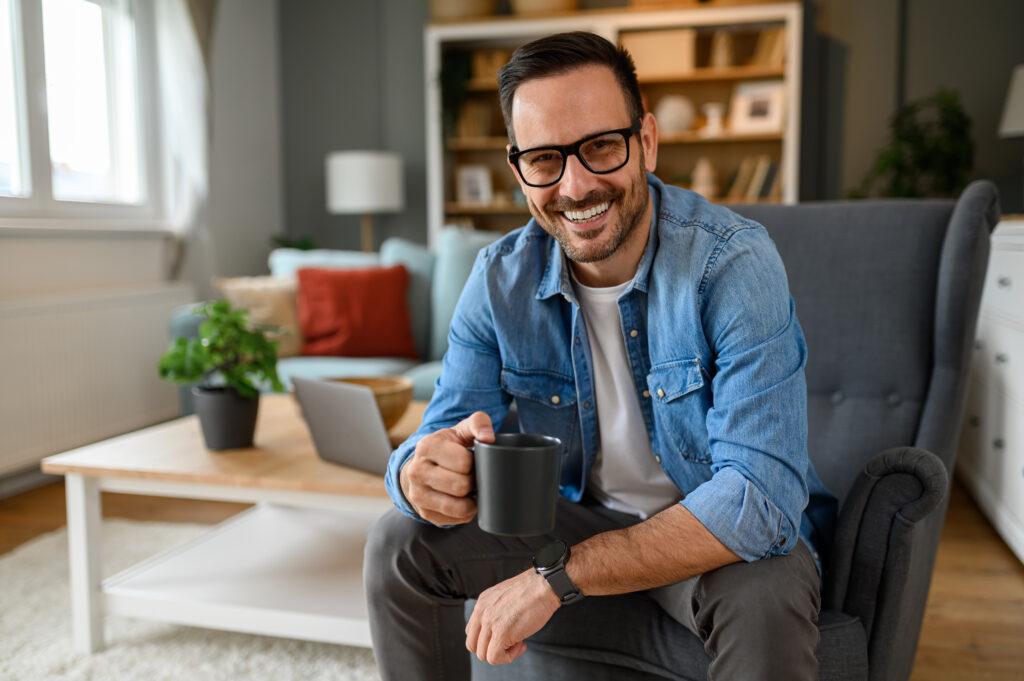 happy businessman drinking coffee